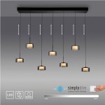 Lampa wisząca Rika z 7 kloszami LED o mocy 56W. Klosze w czarnym, dymionym kolorze, zamocowane na prostokątnej, czarnej podstawie. Widoczna technologia dimmująca simply dim oraz wskaźnik regulacji intensywności światła.