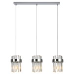 Lampa wisząca Vetro 3xE14 w kolorze chromu z trzema szklanymi kloszami w formie cylindrów. Klosze mają przezroczystą, teksturowaną powierzchnię, zawieszone na cienkich linkach. Metalowy stelaż montowany do sufitu.