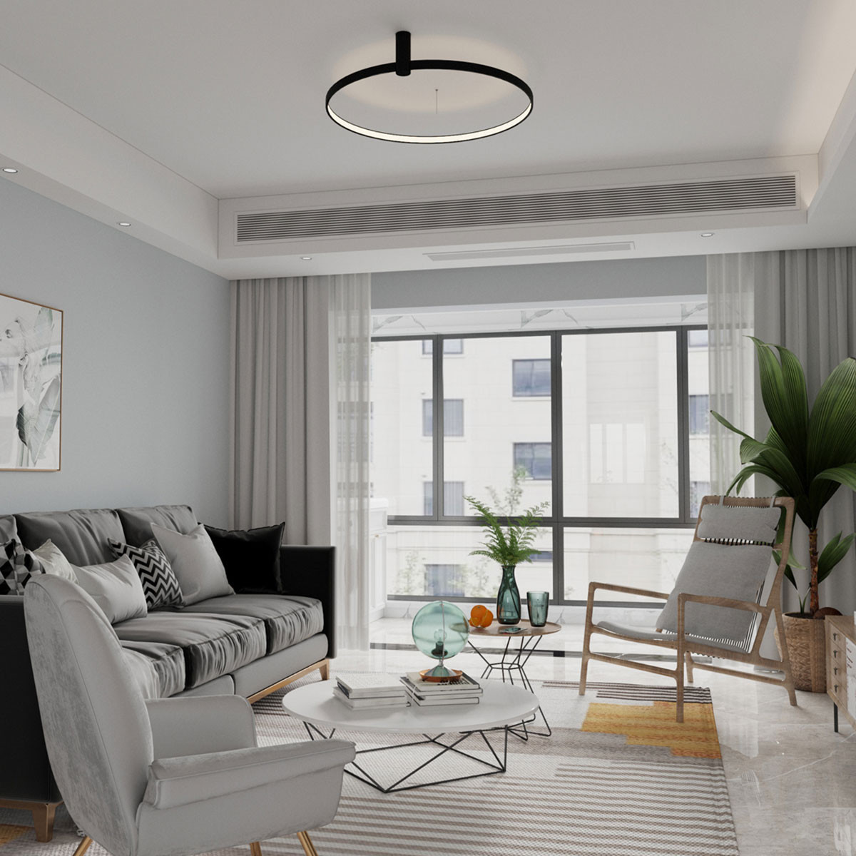 Czarna lampa sufitowa LED Ring D60 o mocy 35W, o okrągłym kształcie, zawieszona na suficie. Wnętrze lampy posiada białą oprawę, która emituje światło. Lampa w nowoczesnym wnętrzu z szaro-białymi ścianami, kanapą i dużymi oknami.