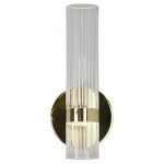 Kinkiet LED Ambiente 18W CCT w kolorze złotym, z przezroczystym kloszem o pionowych żłobieniach. Produkt zamontowany na okrągłej podstawie, emitujący światło w dół. Wysoka jakość materiałów i elegancki design.