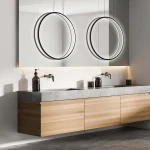 Lampa wisząca LED Mirror D90 w kolorze czarnym, o mocy 50W, IP44. Zawieszona nad umywalką, w otoczeniu dwóch okrągłych luster. Stylowy design z minimalistycznym wykończeniem, idealna do nowoczesnych wnętrz.