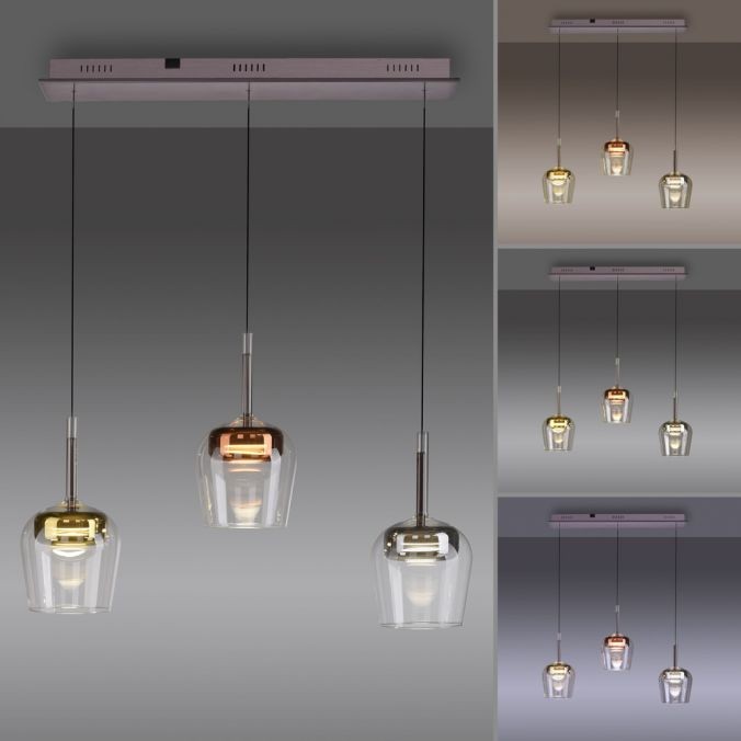 Lampa wisząca Q-kon z pilotem, 3 klosze w różnych kolorach (złoty, miedziany, przezroczysty) na długich zawieszeniach, z regulowanym oświetleniem LED 27W CCT. Montowana na prostokątnej podstawie w kolorze srebrnym.