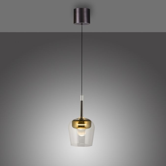 Lampa wisząca Q-kon z pilotem LED 9W CCT w kolorze złotym, z przezroczystym kloszem, zawieszona na cienkim kabelku. Klosz ma kształt stożkowaty, a u góry znajduje się metalowy element montujący. Tło szare, minimalistyczne.