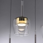 Lampa wisząca Q-kon z pilotem, LED 9W, w kolorze złotym. Szklany klosz o opływowym kształcie, zawieszony na przezroczystym przewodzie. Światło emitowane jest w dół, a podstawa ma połyskujące wykończenie.