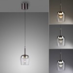 Lampa wisząca Q-kon LED 9W CCT w kolorze srebrnym, z przezroczystym kloszem i metalowym mocowaniem. Zawieszona na cienkim przewodzie, widoczna z przodu. Możliwość regulacji natężenia światła za pomocą pilota.