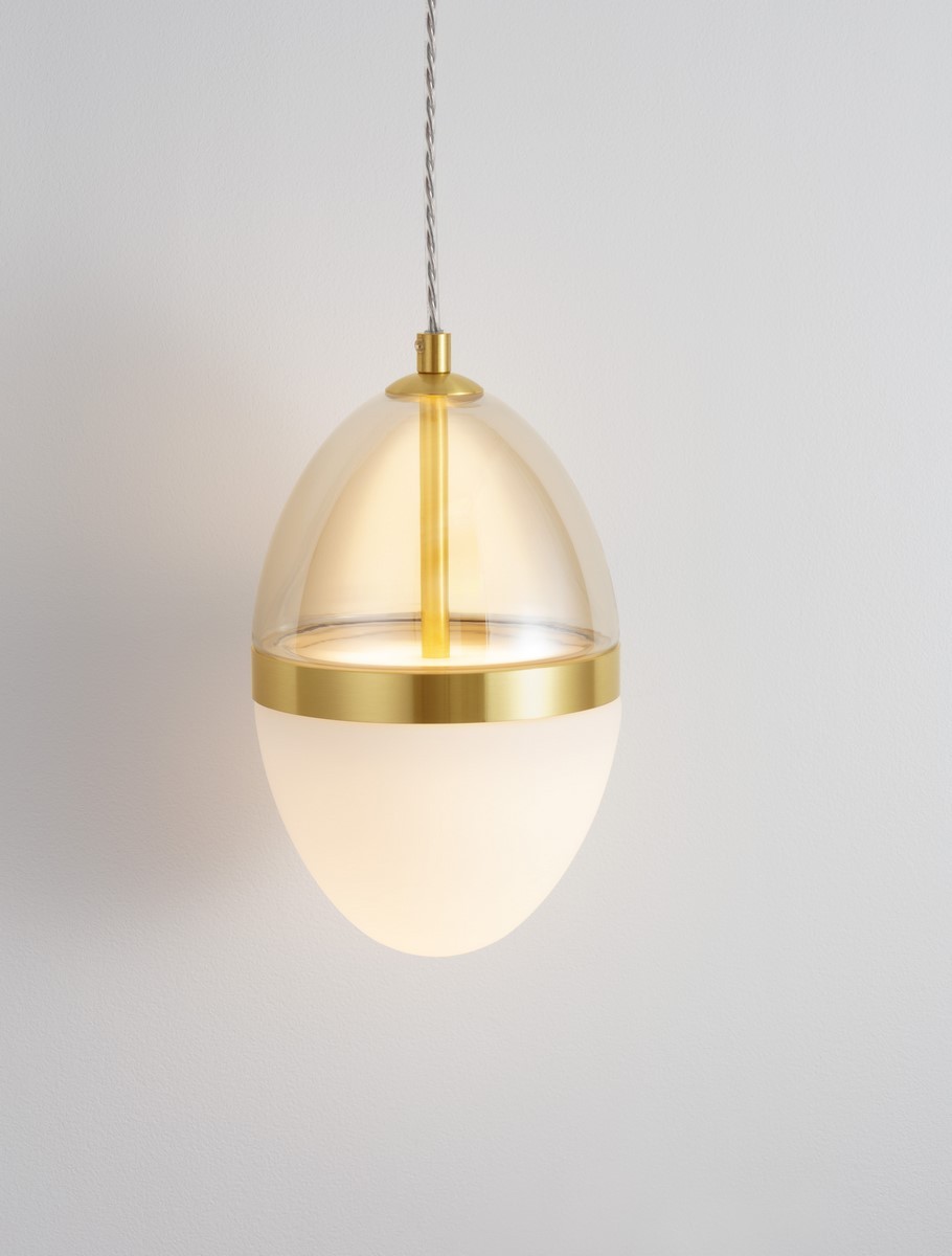 Lampa wisząca Arena 1xLED 20W w złotym kolorze, z przezroczystym kloszem w kształcie jajka. Oświetlenie z białym, matowym elementem na dole, zawieszona na cienkim, metalowym kablu. Idealna do nowoczesnych wnętrz.