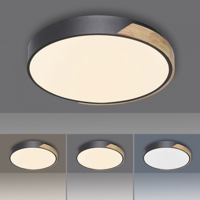 Lampa sufitowa Q-bila LED 35W CCT w kolorze czarnym z drewnianym akcentem, okrągła, umieszczona na jasnym tle, z pilotem do zdalnego sterowania. Widoczne różne warianty podświetlenia w dolnej części zdjęcia.