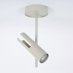 Lampa sufitowa Leda w kolorze szarym beżowym, z jednym punktem świetlnym GU10. Posiada cylindryczny klosz z otworem, zamontowany na prostym wsporniku. Ujęcie z boku, ukazujące detale konstrukcji i wykończenia.