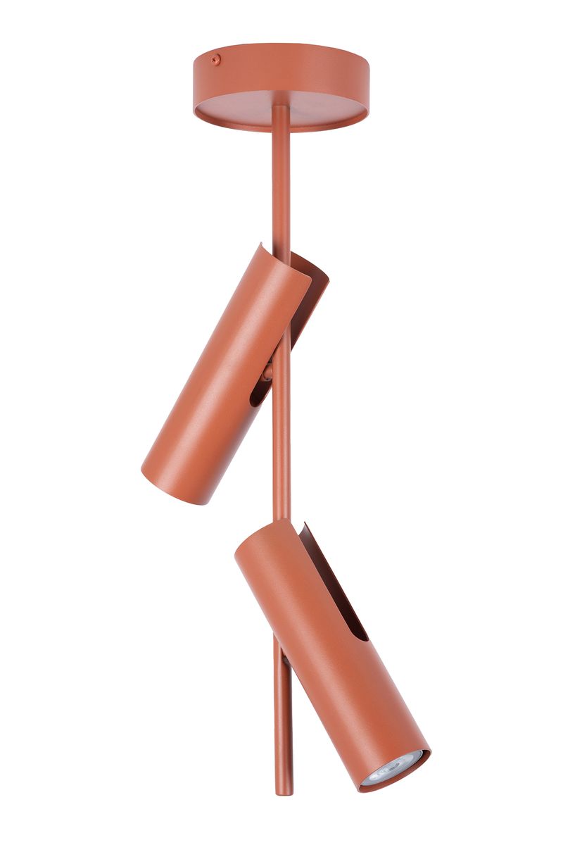 Lampa wisząca Leda w kolorze ceglastym z dwoma oprawami na żarówki GU10. Produkt zawieszony na prostym, okrągłym mocowaniu. Kształt cylindryczny z otworami, umożliwiającymi kierunkowe oświetlenie. Minimalistyczny design do nowoczesnych wnętrz.
