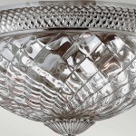 Plafon sufitowy Plantation w antycznym srebrze, z przezroczystym kloszem o teksturowanej powierzchni, kształt okrągły. Widoczna elegancka podstawa z detalami w kształcie liści. Przeznaczony na trzy żarówki E27.