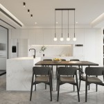 Czarna lampa sufitowa Flare z jednym źródłem światła GU10, IP44, zawieszona w kuchni nad drewnianym stołem. Lampa ma minimalistyczny design i jest częścią nowoczesnego wnętrza z białymi meblami i szarym blatem.