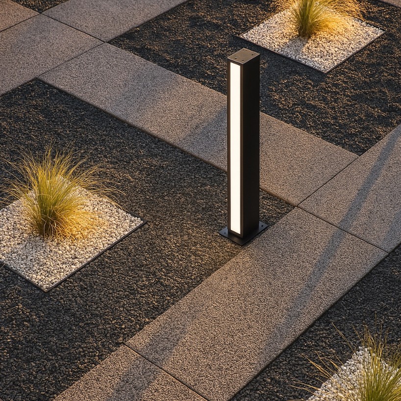 Czarna lampa ogrodowa słupek Roma H60 z dwoma diodami LED 24W, emitująca światło o temperaturze barwowej 4000K. Ujęcie z góry, lampa stoi na podłożu z szarych płyt, otoczona roślinnością i żwirem.