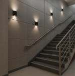 Gantio kinkiet elewacyjny 2xLED 6W 4000K IP44 w kolorze czarnym, montowany na ścianie wzdłuż schodów. Produkt posiada prostokątny kształt i emituje ciepłe światło, idealny do oświetlenia przestrzeni zewnętrznych.