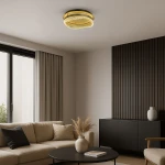 Złota lampa sufitowa LED 36W 4000K, okrągła konstrukcja z przezroczystymi elementami, zamontowana na suficie w nowoczesnym wnętrzu. W tle jasne zasłony i stylowy mebel.