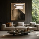 Lampa wisząca LED Gala 52W 4000K w srebrnym kolorze, z dwoma okrągłymi pierścieniami, zawieszona nad okrągłym stołem. W tle widoczna elegancka kanapa i stylowe obrazy na ścianie, w jasnym, nowoczesnym wnętrzu.
