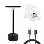 Lampa stołowa LED Tavolo 2,5W CCT w kolorze czarnym z okrągłym kloszem i smukłym stelażem. Widoczny kabel USB oraz instrukcja obsługi. Produkt stoi na okrągłej podstawie.