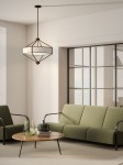 Lampa wisząca Zundo Chocco D60 w brązowym kolorze, z czterema oprawami E27, o geometrycznym kształcie. Zawieszona w nowoczesnym wnętrzu, nad okrągłym stołem, w towarzystwie zielonych foteli i naturalnych dodatków.