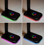 Czarna lampka biurkowa Alma LED 12W/CCT + RGB z okrągłym przyciskiem zmiany kolorów. Widoczna podstawa z efektownym podświetleniem w różnych kolorach: zielonym, czerwonym, różowym i niebieskim. Stojąca, z regulowanym ramieniem.