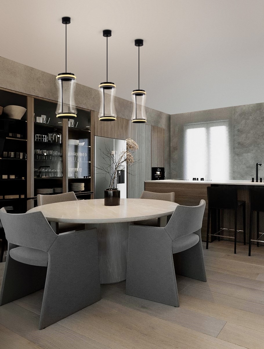 Lampa wisząca Abancay 2xLED 21W w kolorze czarnym, z przezroczystymi kloszami o cylindrycznym kształcie, zawieszona nad okrągłym stołem w nowoczesnej kuchni. Trzy lampy zamontowane na długich przewodach, w tle widoczne szare krzesła i meble.
