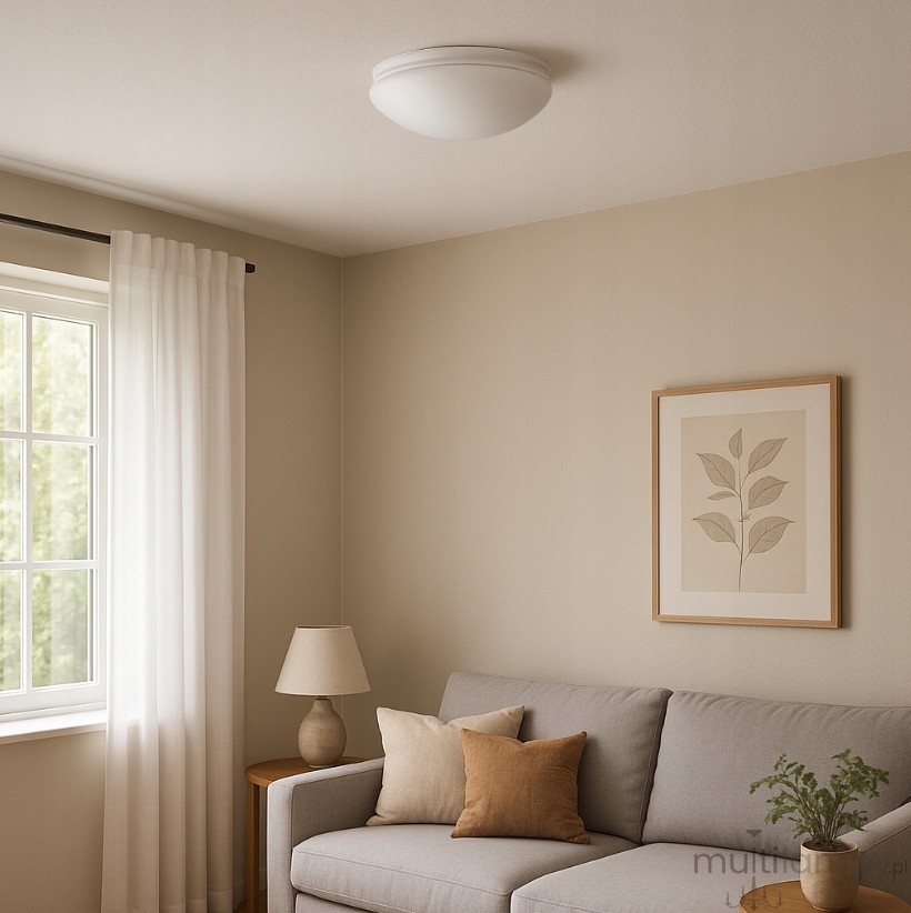 Plafon Lobo D29 w kolorze białym, z dwoma gniazdami E27, o okrągłym kształcie. Zamontowany na suficie, w jasnym wnętrzu z kanapą i lampą. Oświetlenie o stopniu ochrony IP44, idealne do użytku w pomieszczeniach.