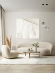 Czarna lampa wisząca Anuco z 1xLED 3W, zawieszona w parze, z przezroczystymi kloszami. Lampa umieszczona w nowoczesnym wnętrzu z jasnymi meblami, na tle obrazu. Długość zawieszenia ukazuje elegancki styl oświetlenia.