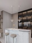 Lampa wisząca Baila z białym kloszem, zawieszona na cienkim kablu. Idealna do nowoczesnych wnętrz, w komplecie z jedną żarówką LED 8W. Widoczna w aranżacji kuchennej nad marmurowym blatem barowym z dwoma stołkami.