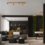 Lampa wisząca Karbon 1, złota, z jedną oprawą GU10, zamontowana na suficie. Wyróżnia się minimalistycznym designem i nowoczesnym wykończeniem, idealna do aranżacji wnętrz. W tle nowoczesna kuchnia z ciemnymi meblami i roślinnymi akcentami.