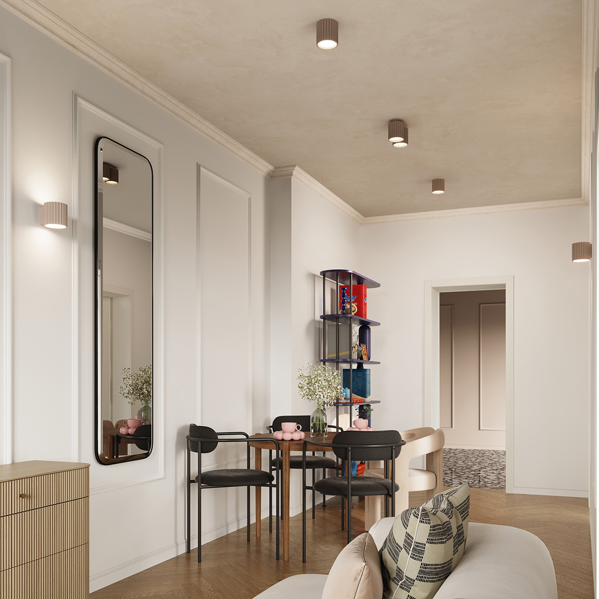 Kinkiet Aura 1xG9 w kolorze taupe, zamontowany na ścianie w nowoczesnym wnętrzu. Posiada delikatną, żebrowaną strukturę. Widoczny w aranżacji z lustrem, stołem i krzesłami, na tle jasnych ścian i drewnianej podłogi.