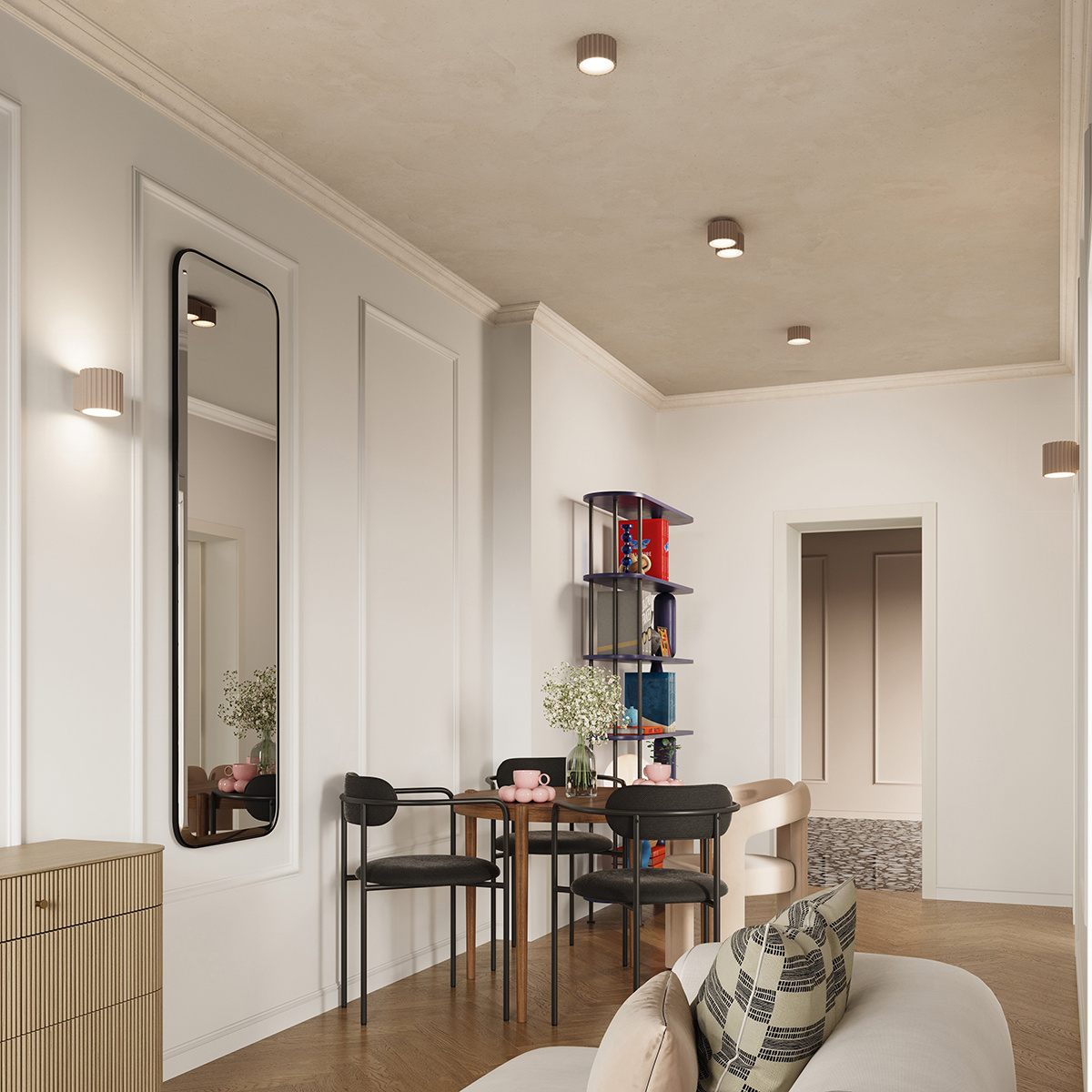 Lampa sufitowa Aura 1xGX53 w kolorze taupe, o okrągłym kształcie, zamontowana na suficie w nowoczesnym wnętrzu. W tle widoczna strefa jadalna z drewnianym stołem i czarnymi krzesłami, a także dekoracyjne półki z kolorowymi akcesoriami.