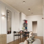 Lampa sufitowa Aura 1xGX53 w kolorze taupe, o okrągłym kształcie, zamontowana na suficie w nowoczesnym wnętrzu. W tle widoczna strefa jadalna z drewnianym stołem i czarnymi krzesłami, a także dekoracyjne półki z kolorowymi akcesoriami.