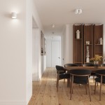 Lampa sufitowa Aura 2xGU10 w kolorze białym, o cylindrycznej formie, zamontowana na suficie w nowoczesnym wnętrzu. W tle widoczna jadalnia z drewnianym stołem i czarnymi krzesłami, jasne ściany oraz drewniana podłoga.