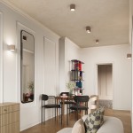 Lampa sufitowa Aura w kolorze taupe z dwoma oprawami GU10, zamontowana na suficie w nowoczesnym wnętrzu. W tle widoczne meble, stół z krzesłami oraz dekoracje. Oświetlenie w formie cylindrycznych kloszy o teksturowanej powierzchni.