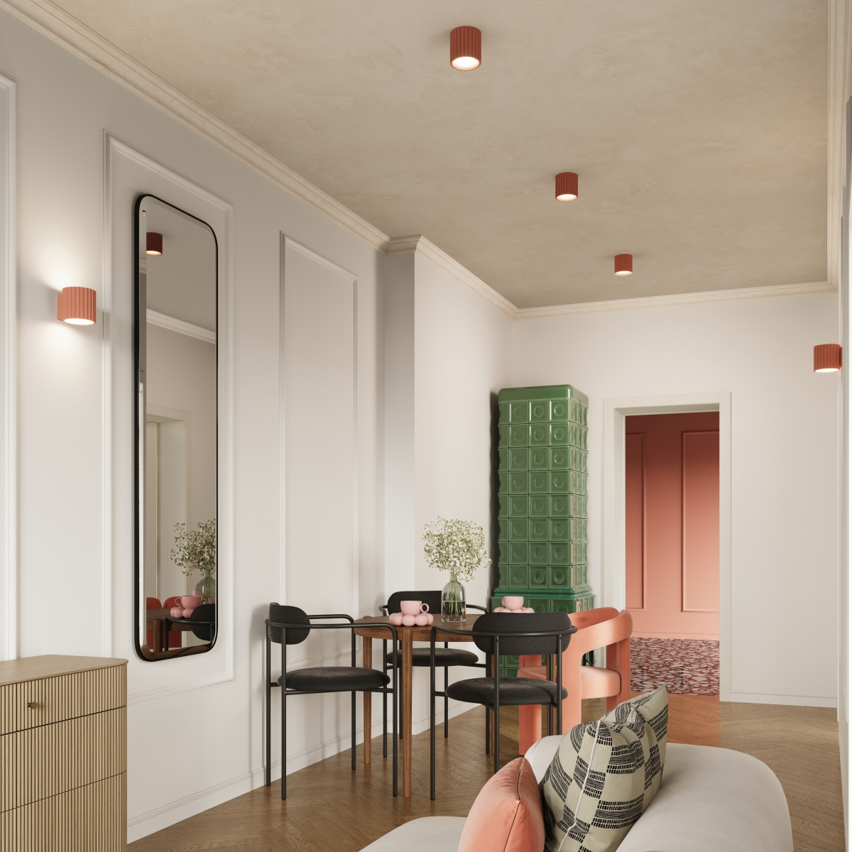 Lampa sufitowa Aura 2xGU10 w brzoskwiniowym kolorze, zamontowana na suficie. W tle widoczne meble w stylu nowoczesnym, stół z czarnymi krzesłami oraz zielona szafa. Ściany jasne, z dekoracyjnymi panelami.