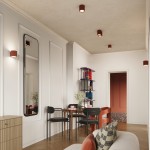 Lampa sufitowa Aura 2xGU10 w kolorze ochra czerwona, zamontowana na suficie. Widoczna w aranżacji wnętrza z drewnianą podłogą, stołem, krzesłami i dekoracjami. Oświetlenie w minimalistycznym stylu, w równych odstępach na suficie.