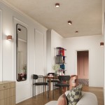 Lampa sufitowa Aura 2xGX53 w kolorze mocca, zamontowana na suficie, z widoczną teksturą. W tle nowoczesne wnętrze z drewnianą podłogą, sofą i stołem z krzesłami, tworzące przytulną aranżację.