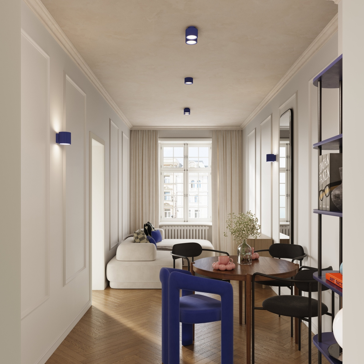 Lampa sufitowa Aura w kolorze ultramaryny z dwoma oprawami na żarówki GX53, zamontowana na suficie w jasnym wnętrzu. Widoczne są również ścienne lampy w tym samym kolorze oraz meble w stylu nowoczesnym.