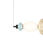 Lampa wisząca LED Tordi 18W 3000K w kolorze czarnym z wielokolorowymi kloszami. W kształcie owalnym, z elementami w błękicie i kremie, zawieszona na cienkim przewodzie. Idealna do nowoczesnych aranżacji wnętrz.
