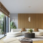 Kinkiet Karbon 20 w kolorze beżowym, z dwoma gniazdami GU10, zamontowany na ścianie w nowoczesnym wnętrzu. Widoczny na tle drewnianej ściany i jasnej sofy.