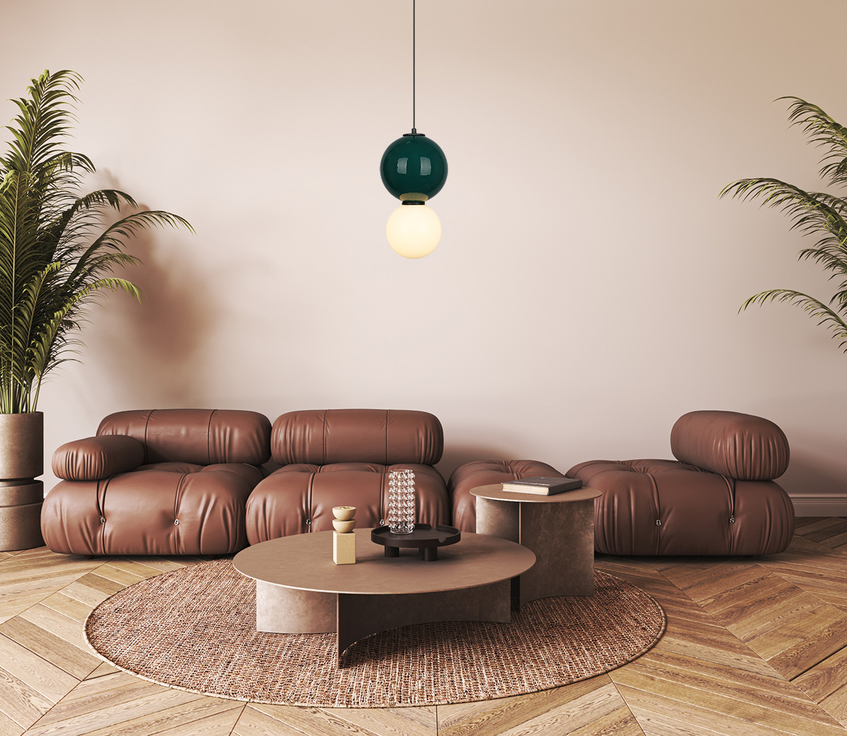 Zielona lampa wisząca LED Pieve D18 o mocy 6W z ciepłym światłem 3000K, zbudowana z dwóch kul: górna w kolorze zielonym, dolna w białym. Wisi nad brązową sofą w nowoczesnym wnętrzu, w otoczeniu roślin i okrągłego stolika.