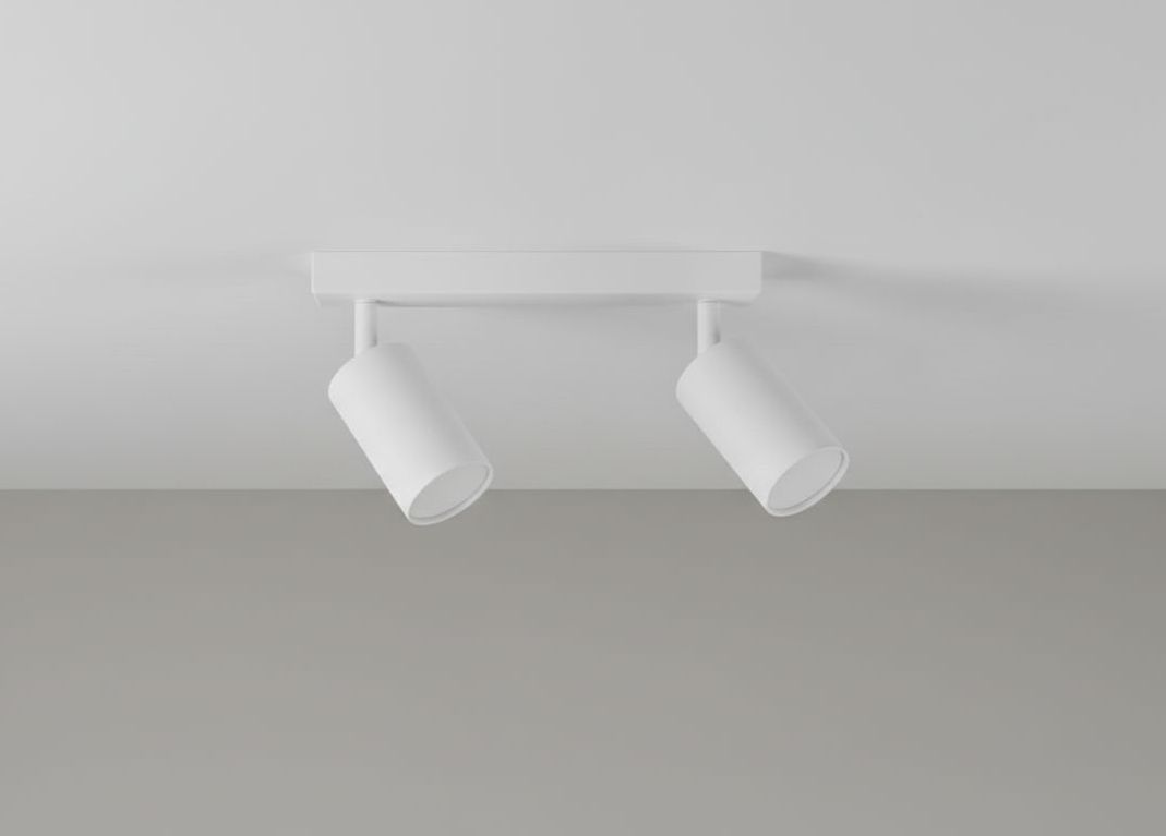 Biała lampa sufitowa (spot) 2-punktowa z podłużnym mocowaniem. Widok z góry, oba reflektory skierowane na zewnątrz. Prosty, nowoczesny design, idealna do oświetlenia wnętrz w różnych aranżacjach.