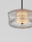 Lampa wisząca Espinar z przezroczystym kloszem w formie okrągłej, z widocznym źródłem światła LED 6W w złotej oprawie. Ujęcie z dołu, na jednolitym, jasnym tle, ukazuje teksturę klosza oraz stylowe wykończenie.