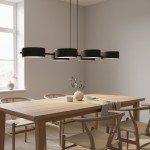Lampa wisząca Drumz 6xE14 w kolorze czarnym, złożona z sześciu okrągłych kloszy, zawieszona na cienkich linkach. Produkt umieszczony nad drewnianym stołem w jasnym wnętrzu, z oknem w tle i dekoracjami na stole.