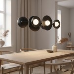 Lampa wisząca Volum 6xG9 w kolorze czarnym, składająca się z okrągłych kloszy, zawieszona nad drewnianym stołem. W tle widoczne okno z zasłonami oraz dekoracje na stole i w pomieszczeniu.