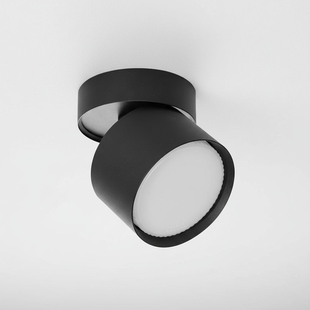 Lampa sufitowa Apilo w kolorze czarnym z jednym spotem GX53. Posiada okrągły klosz z matowego szkła, zamocowana pod kątem do sufitu. Wykonana z metalu, o minimalistycznym designie, idealna do nowoczesnych wnętrz.