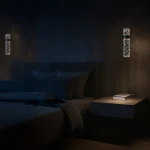 Lagos lampa wisząca LED 8W 4000K w złotym kolorze, o cylindrycznym kształcie, zawieszona nad stolikiem nocnym. W tle widoczne poduszki i narzuta na łóżku w sypialni, stonowane oświetlenie tworzy przytulną atmosferę.