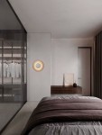 Kinkiet Huanuco 1xLED 17W w kolorze niklu, wykonany z aluminium, zamontowany na ścianie. Okrągły, minimalistyczny design, emitujący ciepłe światło. Otoczenie: nowoczesna sypialnia z szafą przeszkloną, drewnianym stolikiem i szarym narzutą na łóżku.