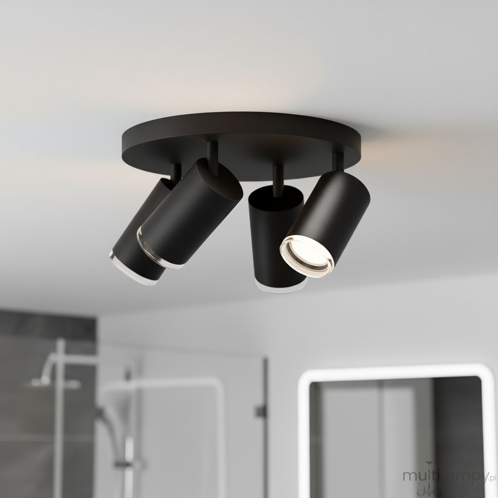 Czarna lampa sufitowa Turyn IP44 z czterema reflektorami GU10, zamontowana na okrągłej podstawie. Reflektory mają cylindryczny kształt, skierowane w różne strony, na tle jasnego sufitu w nowoczesnej aranżacji wnętrza.