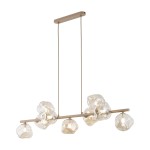 Lava Sabia lampa wisząca w kolorze beżowym, z dziewięcioma kloszami w kształcie organicznych form, zawieszona na cienkich linkach. Metalowa, prostokątna podsufitka w odcieniu beżu. Klosze wykonane z przezroczystego szkła, emitujące ciepłe światło.