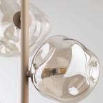 Beżowa lampa wisząca Lava Sabia z trzema źródłami światła G9. Klosze o organicznych kształtach w kolorze przezroczystym, z widocznymi diodami LED. Ujęcie z góry, ukazujące detale kloszy i mocowania.
