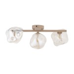 Beżowa lampa sufitowa Lava Sabia z trzema kloszami w kształcie organicznych, szklanych kul. Klosze mają przezroczystą fakturę, zamontowane na metalowym stelażu. Lampa ma nowoczesny, minimalistyczny design, idealna do różnych wnętrz.